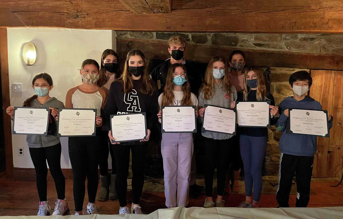 The Putnam Hill Chapter of the Daughters of the American Revolution recently honored all of the students whose essays got high marks in the chapter’s annual essay writing contest. At front, from left, are Ellia Kutai, Elsa Wang, Summit Mock, Ella Starpoli, Taylor DeVries, Tatum Wunderlich and Manual Saelens. In back, from left, Izzie Nassa, Peter Passaro and Olivia DeVries. Students Lakshmi Neelavilli, Jacqueline Mulle and Lindsey Mulle were also honored but were not able to attend the event.