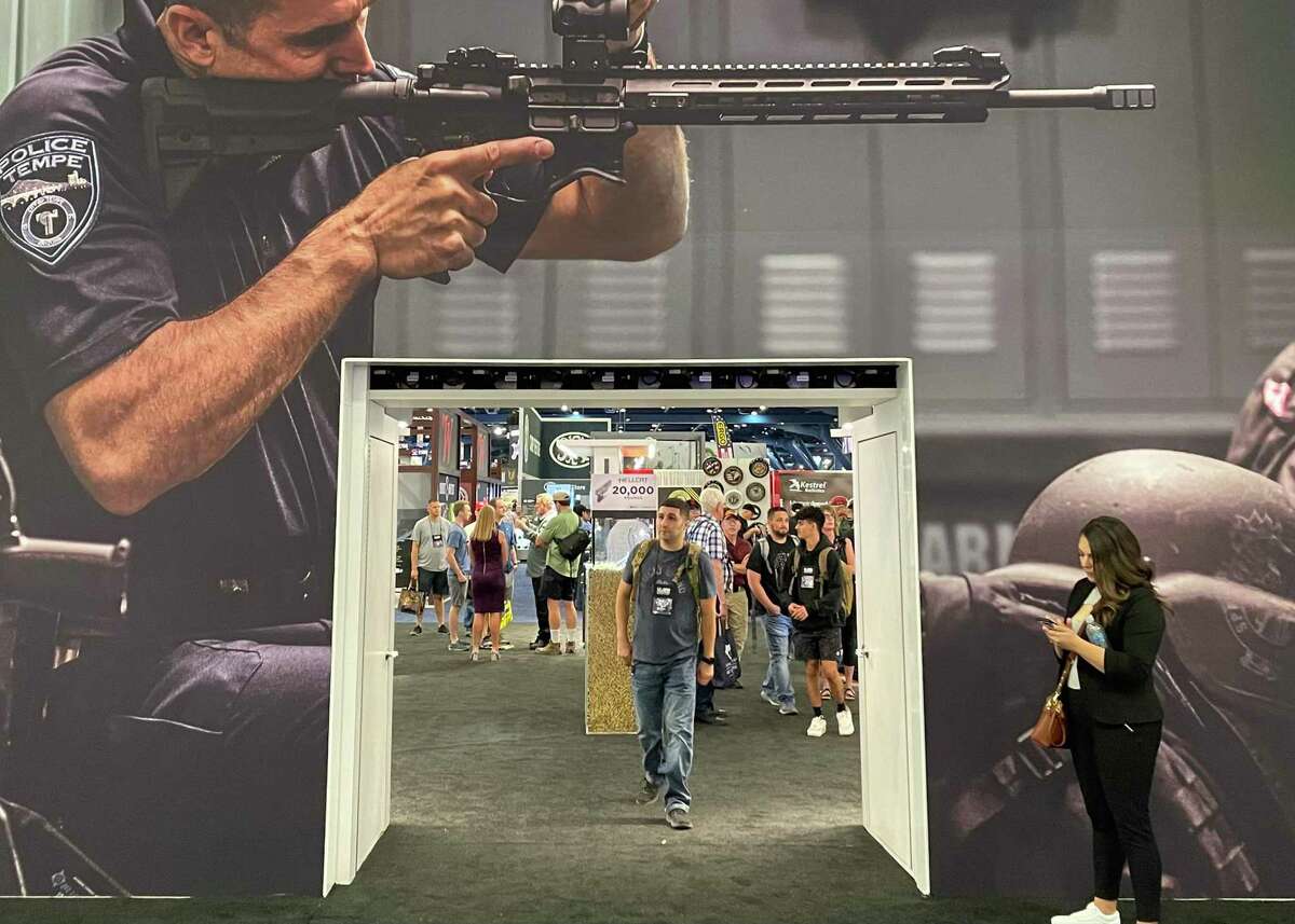 At first glance, the National Rifle Association’s annual meeting looked like any trade show, but then the assault-style weapons, which dominated the exhibit floor, came into focus.