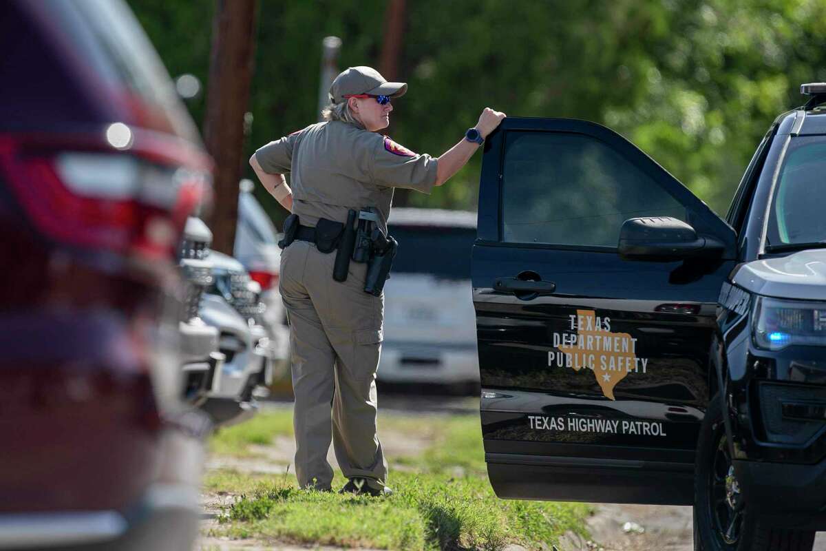 A Texas DPS soldier waits by his vehicle during the funeral of Jayce Carmelo Luevanos and Jailah Nicole Silguero at Sacred Heart Catholic Church in Uvalde on Friday.