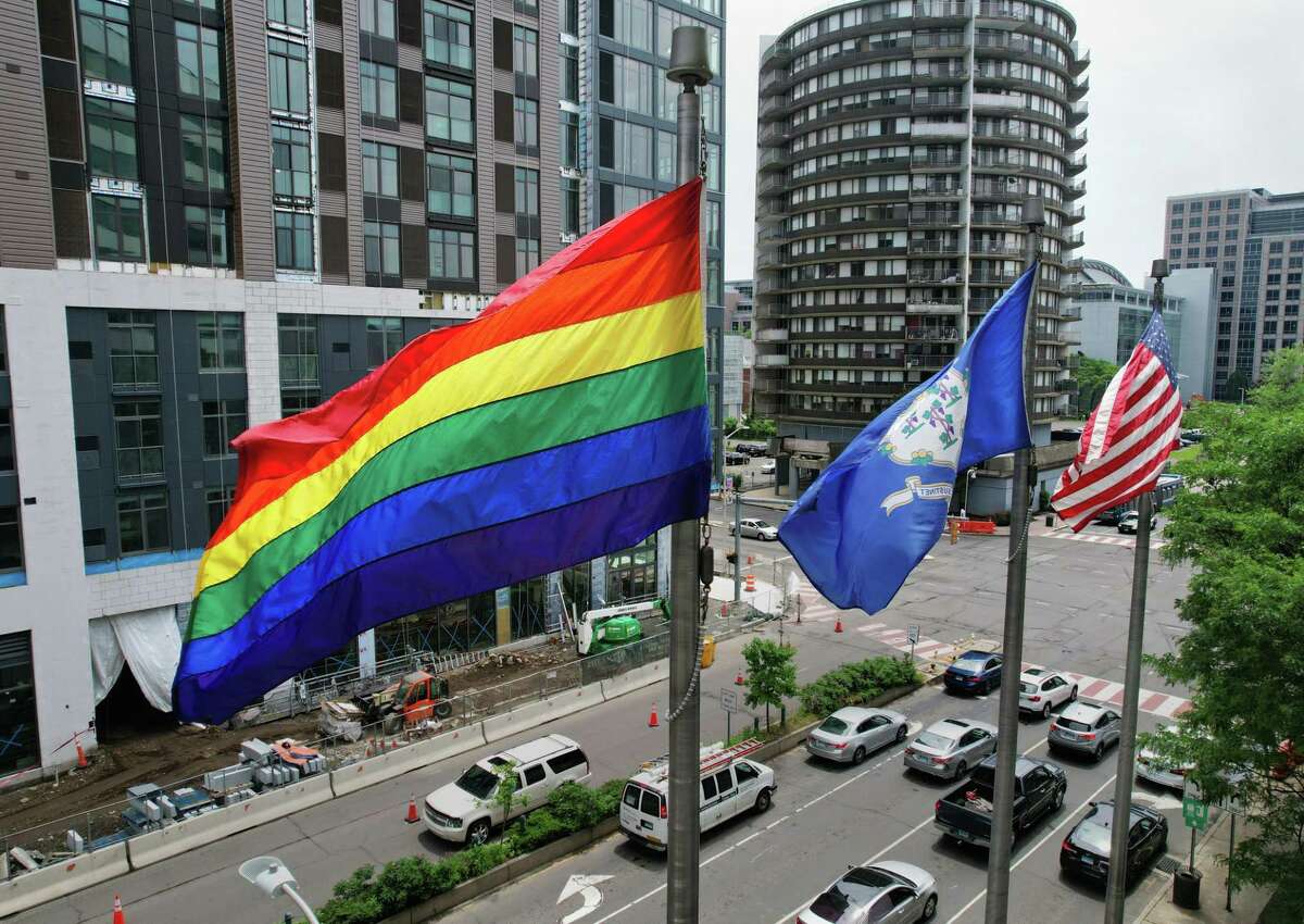 A rainbow flag flies outside the Government Center in Stamford, Conn. Thursday, June 2, 2022. Stamford Mayor Caroline Simmons joined Stamford Pride outside the Government Center to raise a rainbow flag kicking off LGBTQ+ Pride Month.