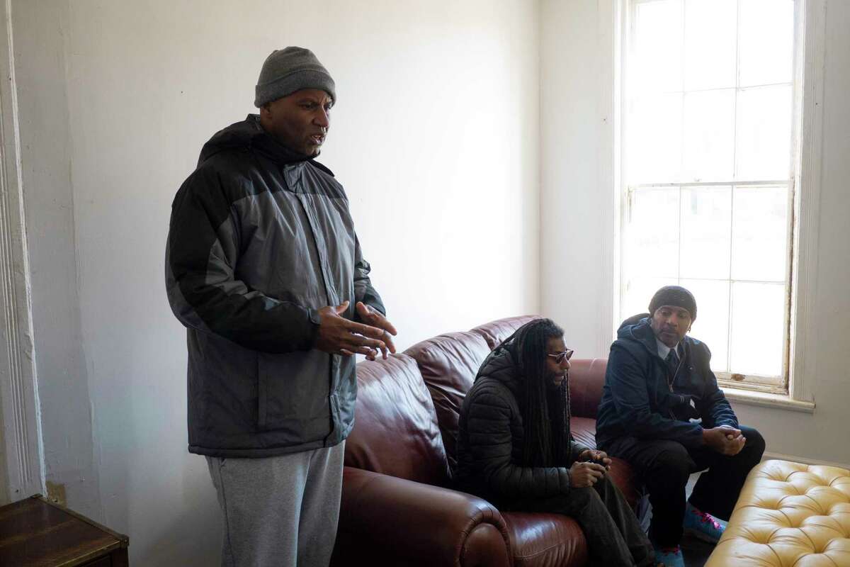 Charles Robinson, left, and his brothers, Stevie Robinson, center, and Mark Robinson, talk about why they feel their family should be among the first to receive licenses from the state to sell recreational marijuana during an interview on Monday, March 28, 2022, in Albany, N.Y. (Paul Buckowski/Times Union)