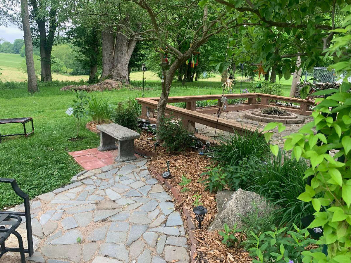 Walkways, benches, a patio and firepit create an inviting outdoor area in Garden D in the Edwardsville-Glen Carbon Area tour on June 10 and 11.
