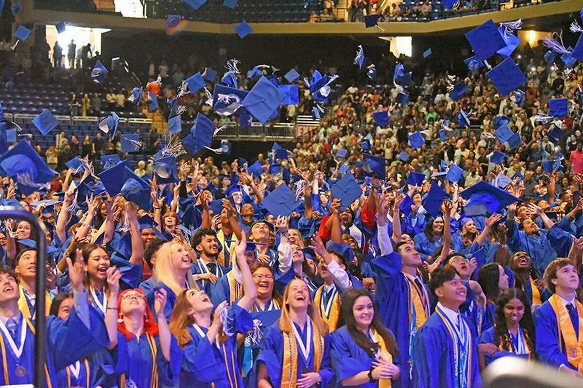 Cypress Creek High School graduates toss their caps in celebration at the conclusion of their commencement ceremony on May 24 at the Berry Center. They were among the more than 8,800 seniors to walk across the stage at 12 CFISD graduations held May 24-28.