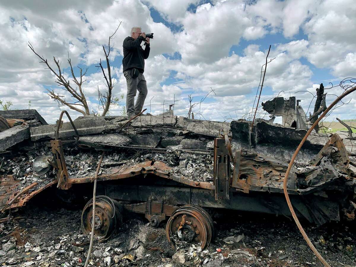 Getty Images special correspondent John Moore photographs from a former frontline position on May 16, 2022 on the outskirts of Kharkiv, Ukraine.