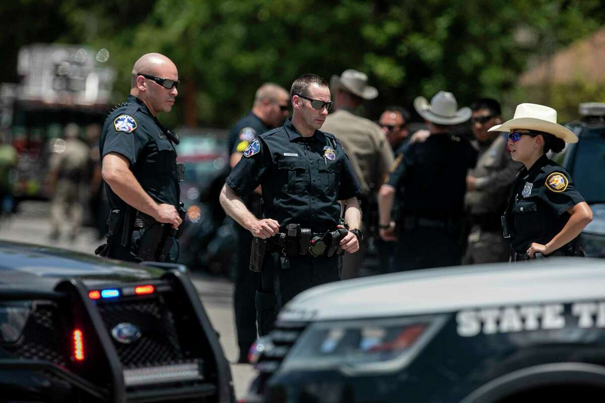 Law enforcement officers from across the state speak outside during the funeral of Jacklyn Jalyen Cazares at Sacred Heart Catholic Church in Uvalde, Texas on June 3, 2022.