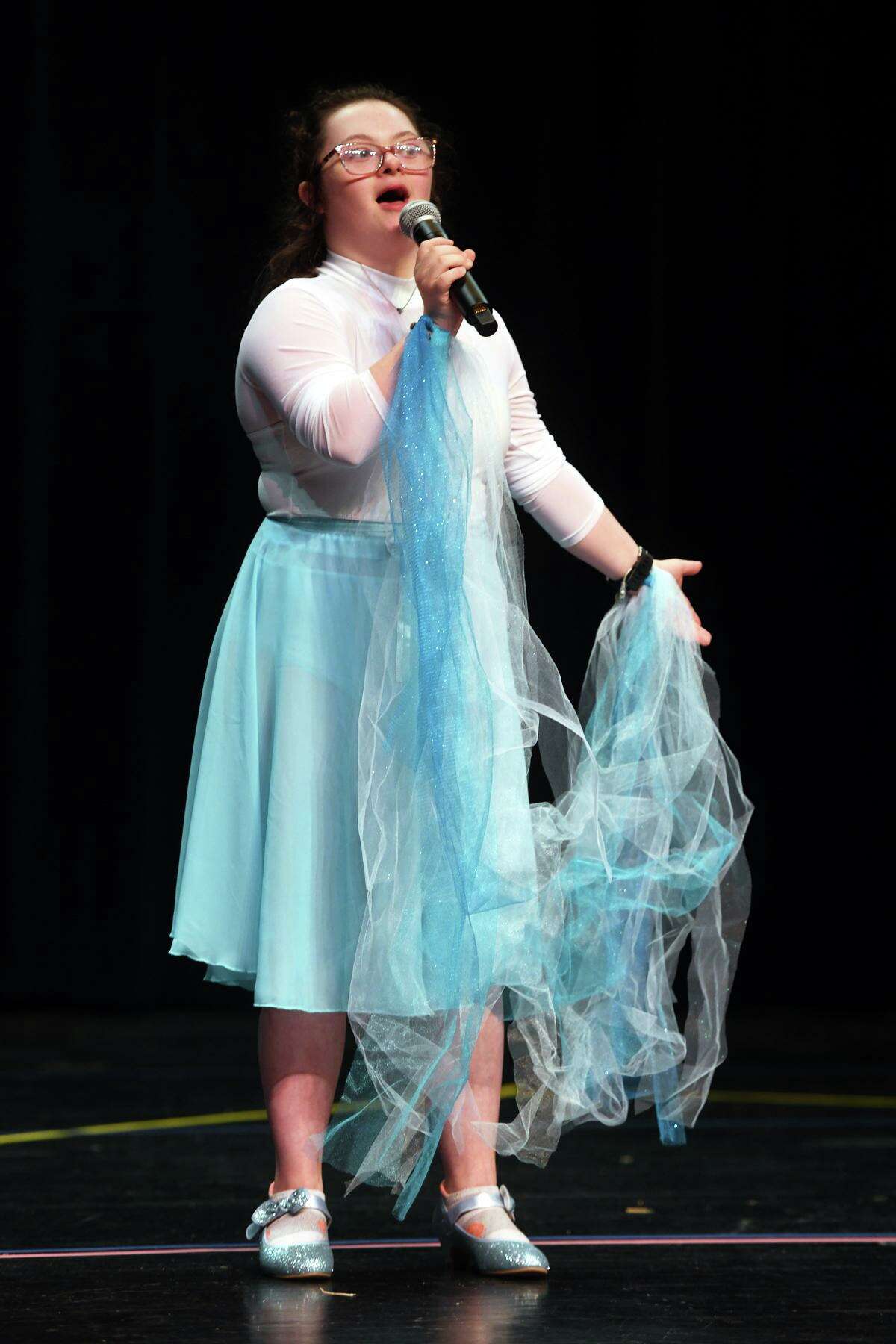 Faith Berni in the roll of Elsa sings during rehearsals for The Milford Adaptive Program’s production of “Frozen” on stage at the Parsons Complex Auditorium, in Milford, Conn. June 2, 2022.