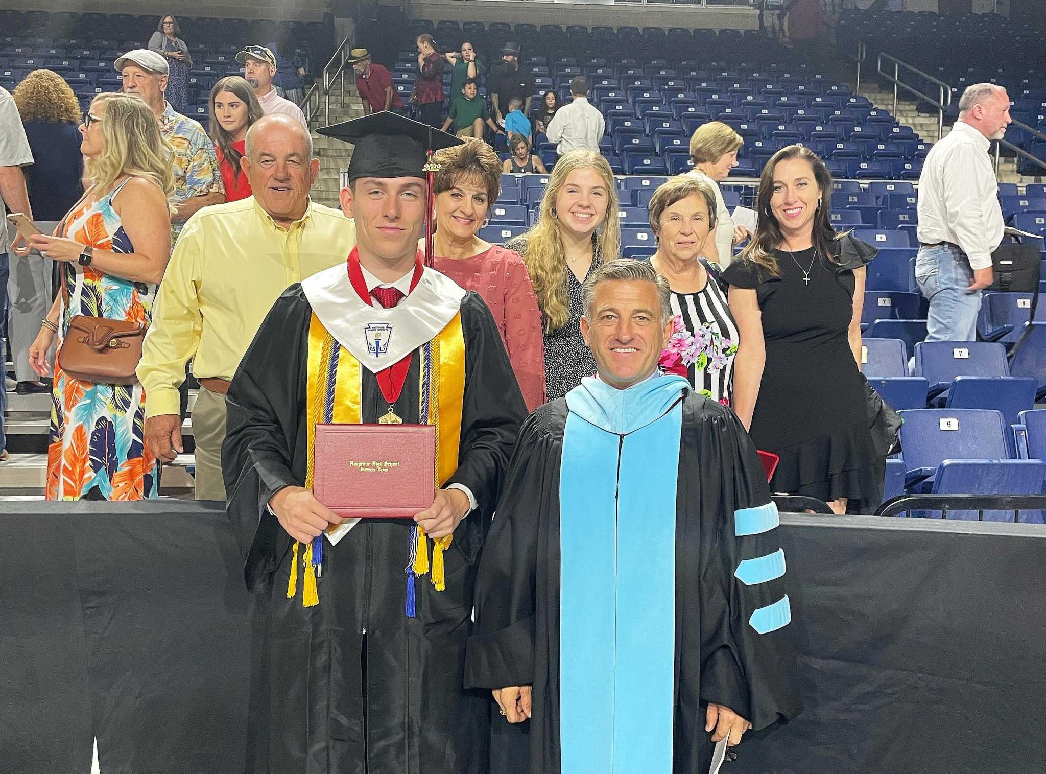 Huffman superintendent awards diploma to his son