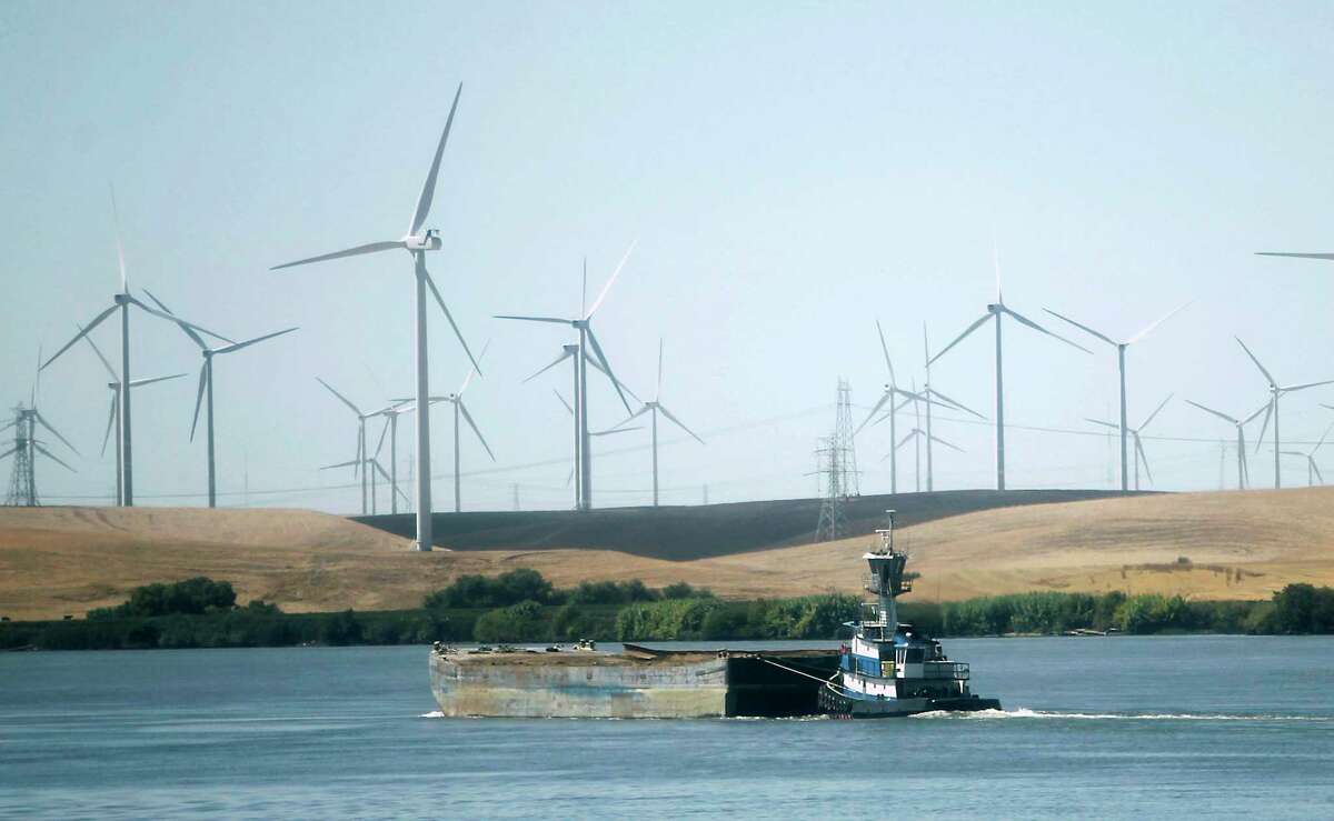 Wind turbines turn near Rio Vista. If California needs to start now if it is going to build the offshore wind-power capacity it needs by 2030.