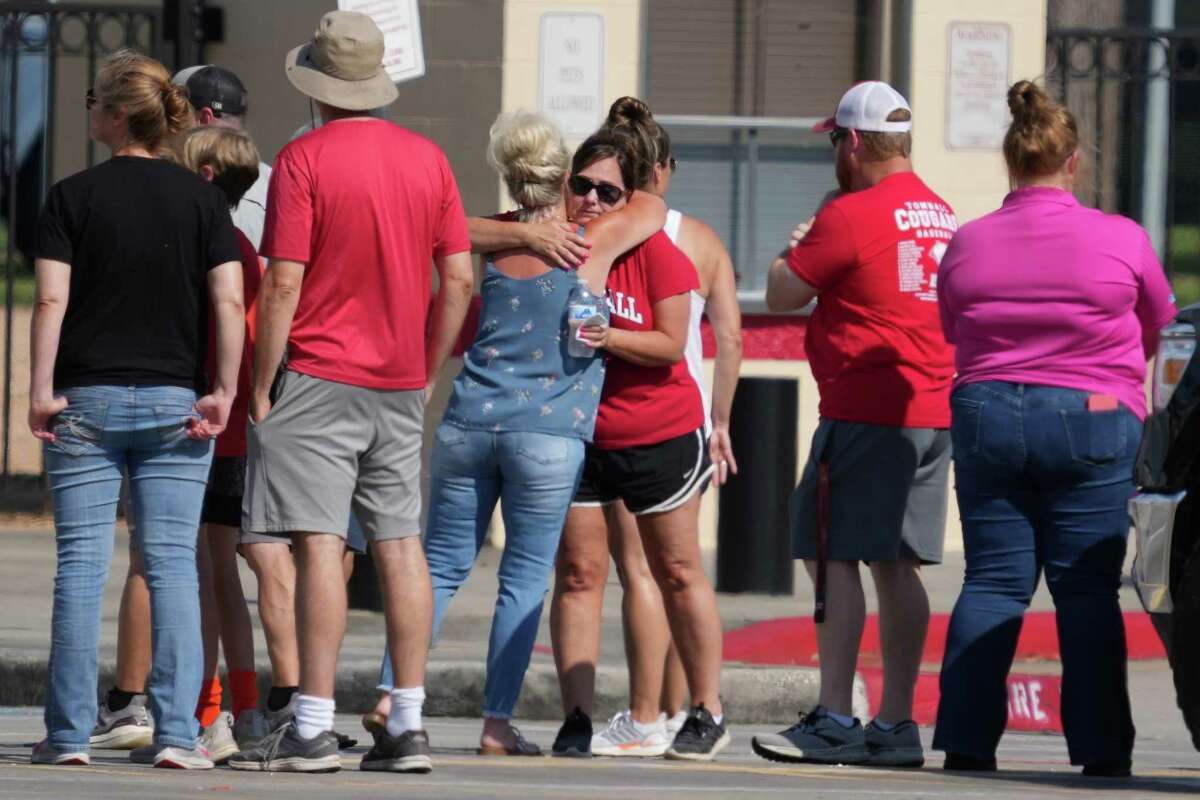 People gather for a community vigil at Tomball High School for the five members of an area family who were killed by an escaped TDCJ prisoner Friday, June 3, 2022 in Tomball. 