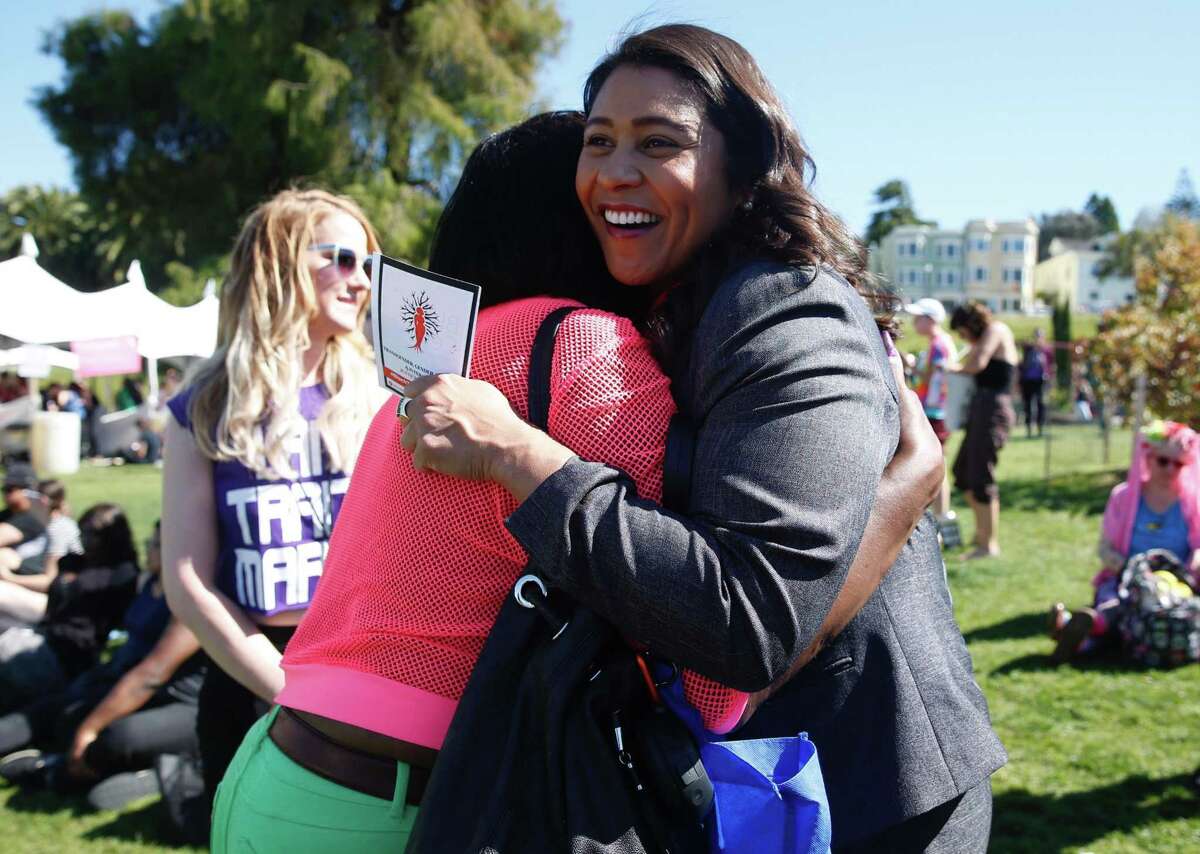 Incoming Mayor London Breed hugs a supporter while making an appearance before the start of the 2018 Trans March in San Francisco.
