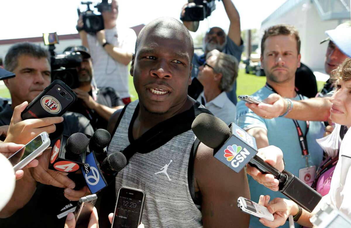 Running back Frank Gore, (21) talks with the news media as the San Francisco 49ers' veteran players reported to training camp today to prepare for the 2014 season at their practice facility in Santa Clara, Calif., as seen on Wednesday July 23, 2014.