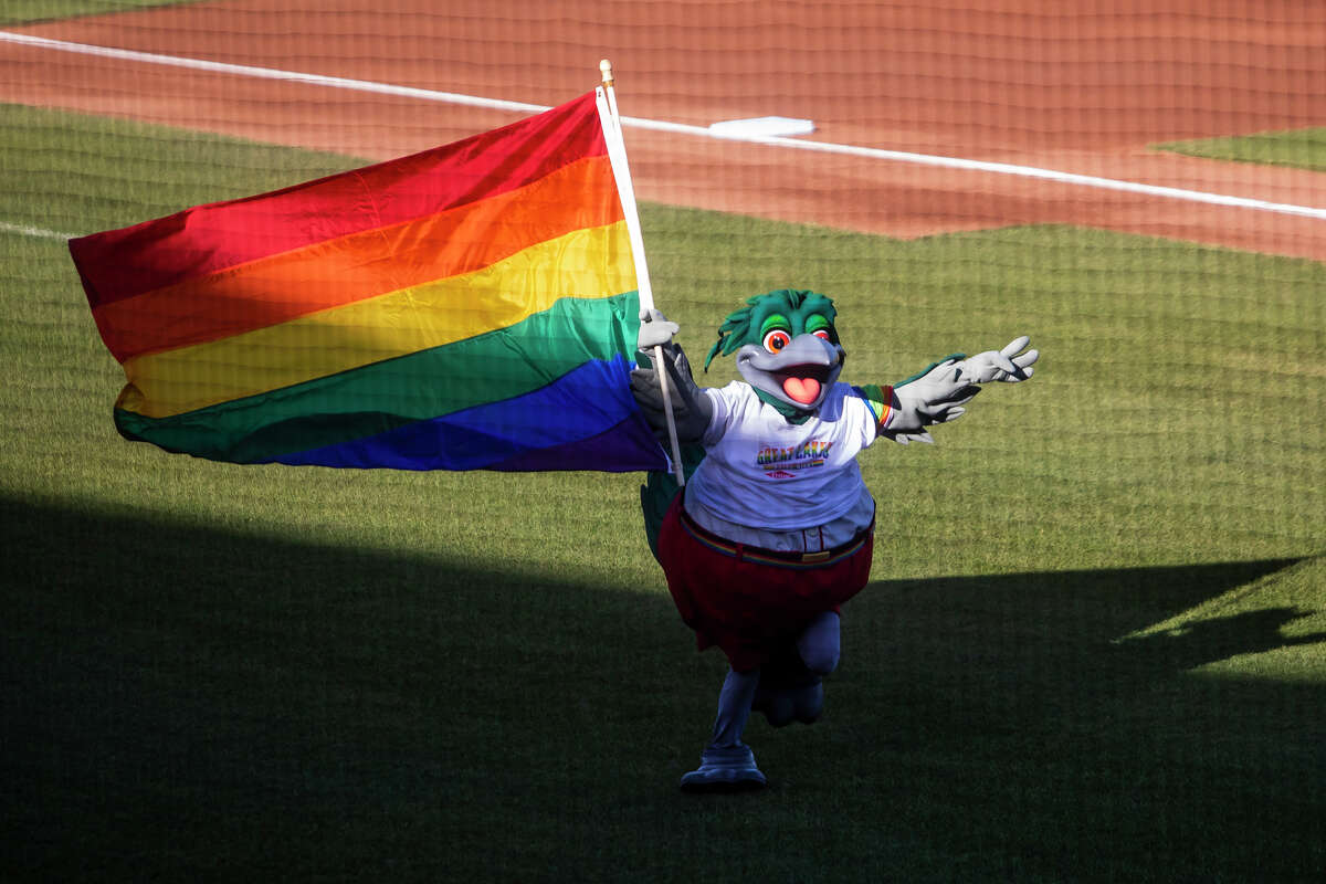 Lou E. Loon carries a pride flag before a game between the Great Lakes Loons and the Fort Wayne Tincaps on Pride Night, Friday, June 3, 2022 at Dow Diamond.