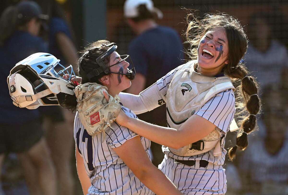 O'Connor catcher Meiko Dominguez celebrates with pitcher Sammie Portillo after Dominguez was able to make a successful throw to Portillo after a wild pitch to put out an El Paso Americas runner during Class 6A state softball semifinal action in Austin on Friday, June 3, 2022.