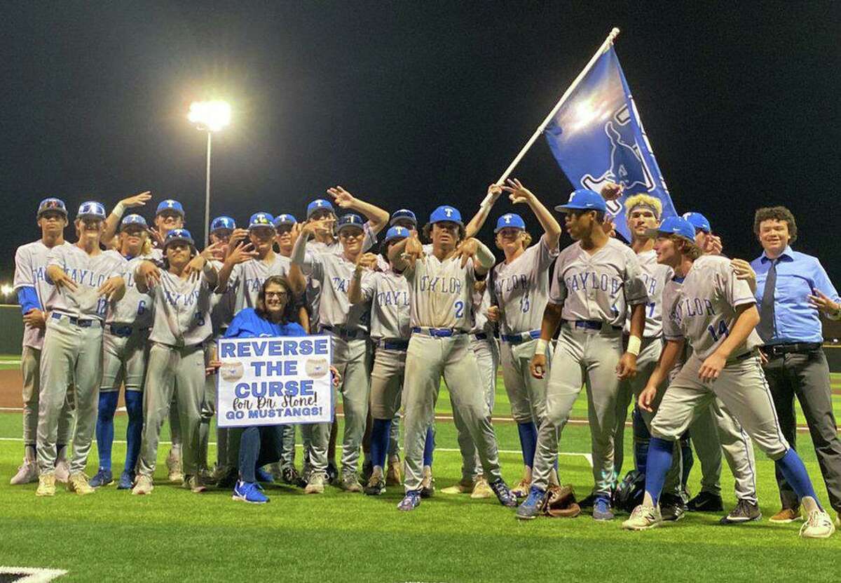 The Taylor baseball team celebrates its first area championship in eight years following a 1-0 victory against Cy-Fair in game three of the series.