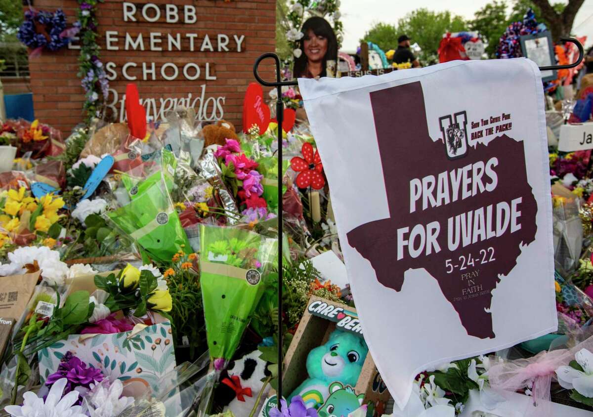 The temporary memorial is seen in front of Robb Elementary School Tuesday, May 31, 2022 in Ovalde, one week after the killing of 19 children and two adults at the school on May 24, 2022 by a gunman with an assault rifle.