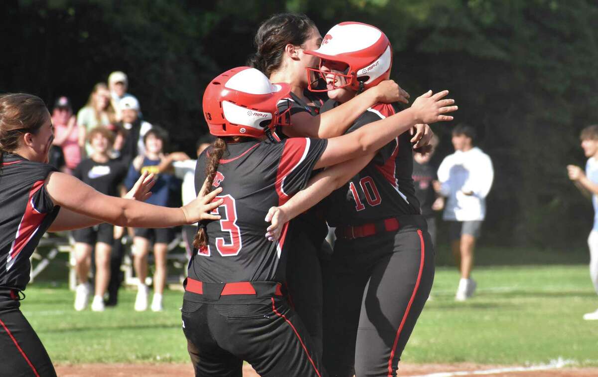 Masuk’s Kathryn Gallant is met by teammates after hitting a walk off double against St. Joseph in the Class L quarterfinals Friday in Monroe.