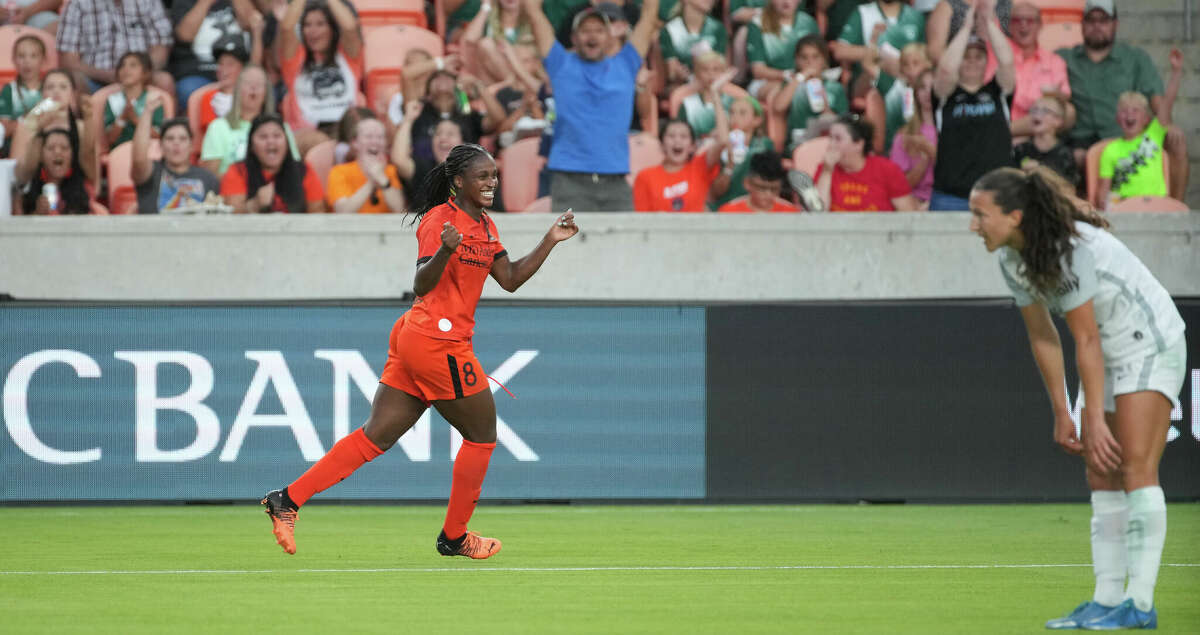 Houston Dash forward Nichelle Prince (8) celebrates after scoring a goal against the Orlando Pride during the first half of an NWSL match at PNC Stadium on Friday, June 3, 2022, in Houston.