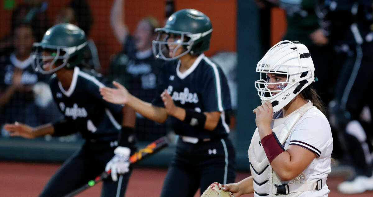 Deer Park catcher Erin Perez (15) watches as Paris Johnson #1 of Lake Ridge celebrates after hitting a 2-RBI double in the fourth inning of a Class 6A semifinal game during the UIL State Softball Championships at Red & Charline McCombs Field, Friday, June 3, 2022, Austin. Lake Ridge scored six runs in the inning to take a 6-2 lead.