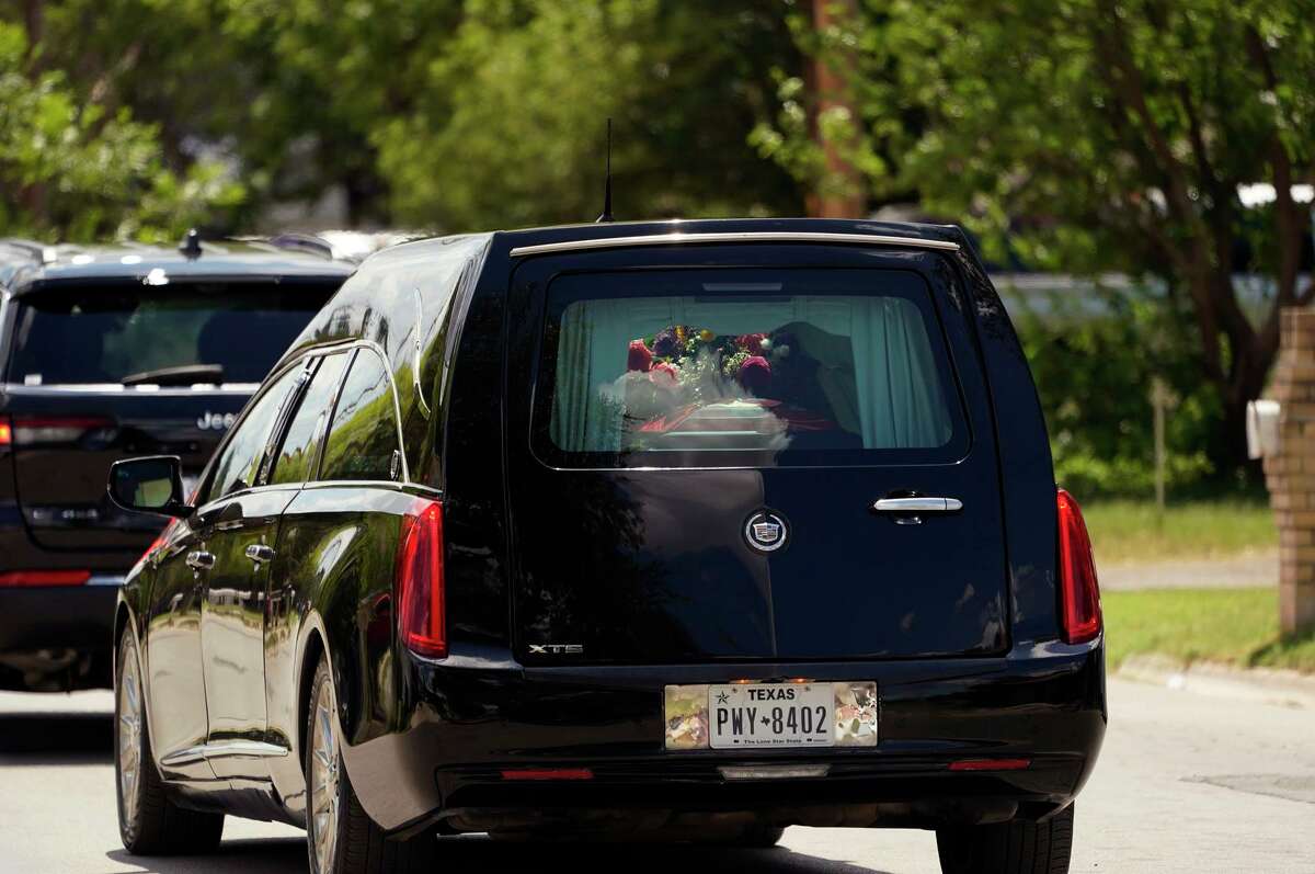 A hearse with the casket of school shooting victim Jacklyn Cazares passes through Uvalde, Texas, on Friday.