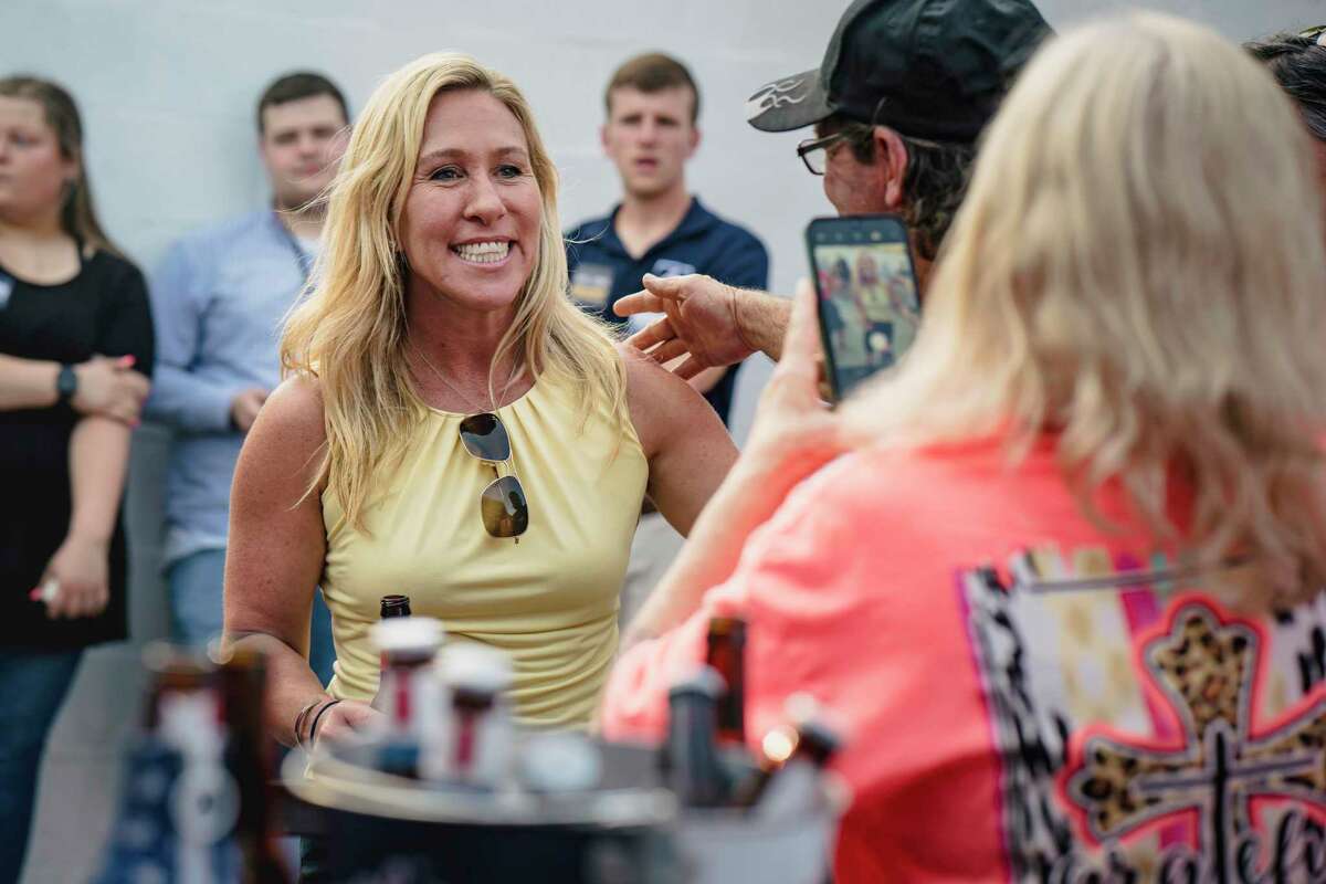 Rep. Marjorie Taylor Greene (R-Ga.) at a Bikers for Trump rally in Plainville, Ga., May 20, 2022. Greene, the far-right conspiracy theorist who won the Republican nomination to retain her seat on Tuesday, May 24, 2022, spent nearly $183,000 in campaign money on personal security in the first quarter of this year, more than any other candidate, campaign finance filings show. (Nicole Craine/The New York Times)