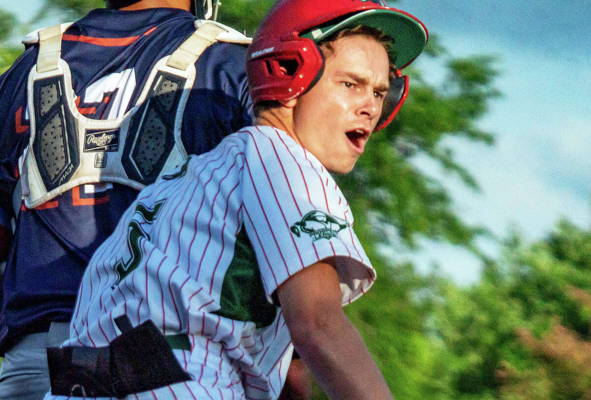 Blake Burris of the Alton River Dragons scored the winning run in the top of the eighth inning in his team's 11-10 win over the O'Fallon Hoots Friday night at CarShield Field in O'Fallon, Mo.