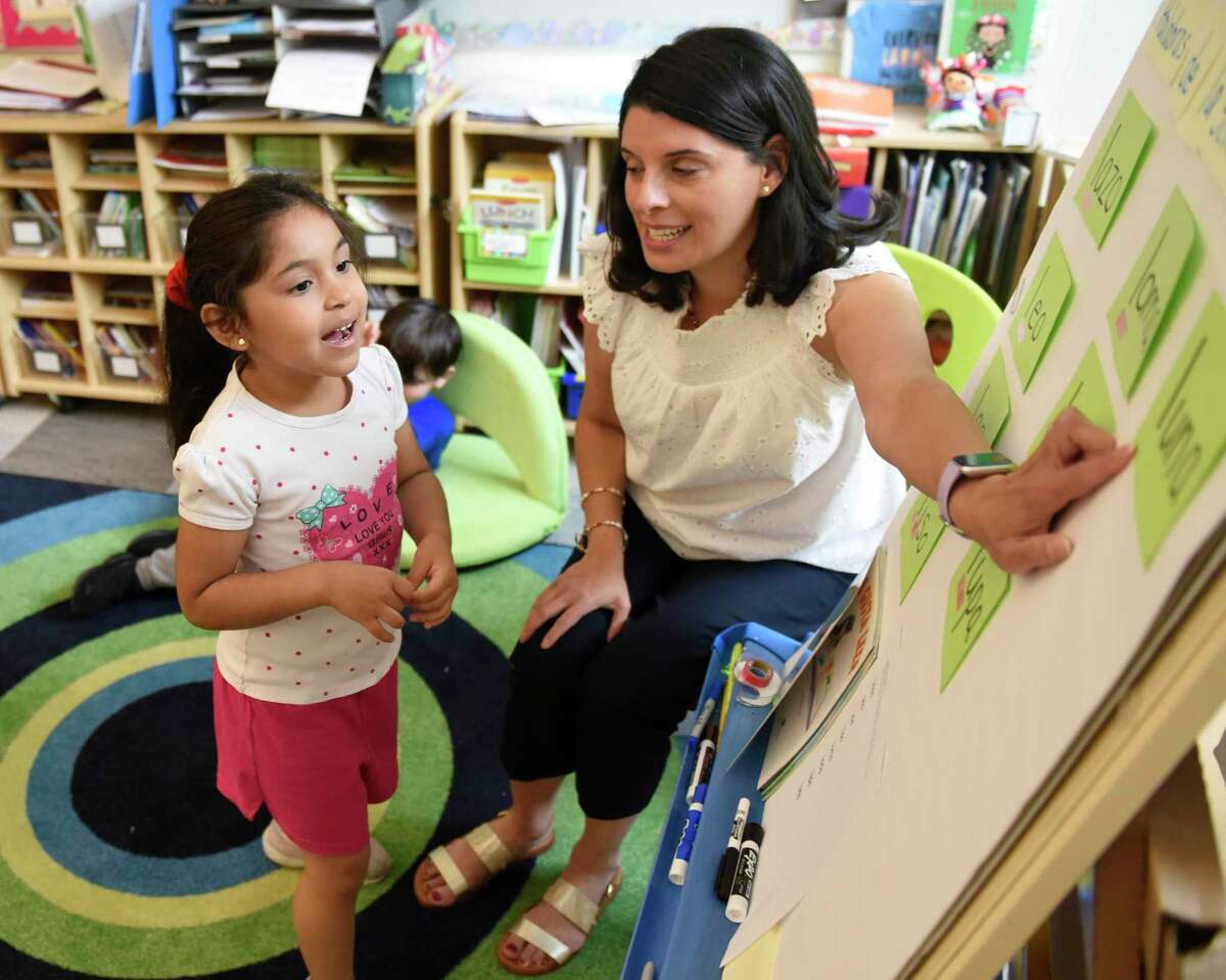 Kindergarten student Avril Portilla-Vargas says a word in Spanish with bilingual language teacher Ana Chejin at New Lebanon School in the Byram section of Greenwich, Conn. Wednesday, June 1, 2022. Chejin teaches bilingual language at New Lebanon School and Hamilton Avenue School to give early elementary students a head start to English and Spanish proficiency as they progress into middle and high school.