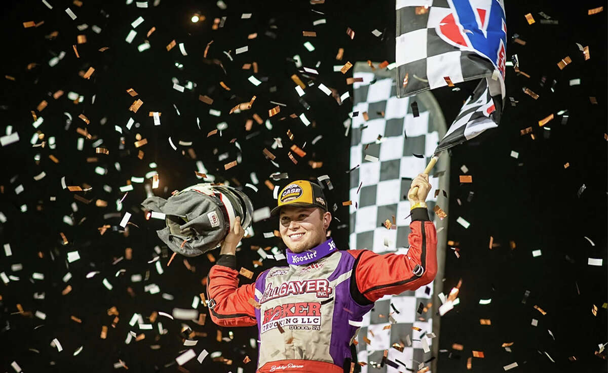 Bobby Pierce celebrates his win Friday night at the World of Outlaws feature Friday night at Tri-City Speedway in Granite City.