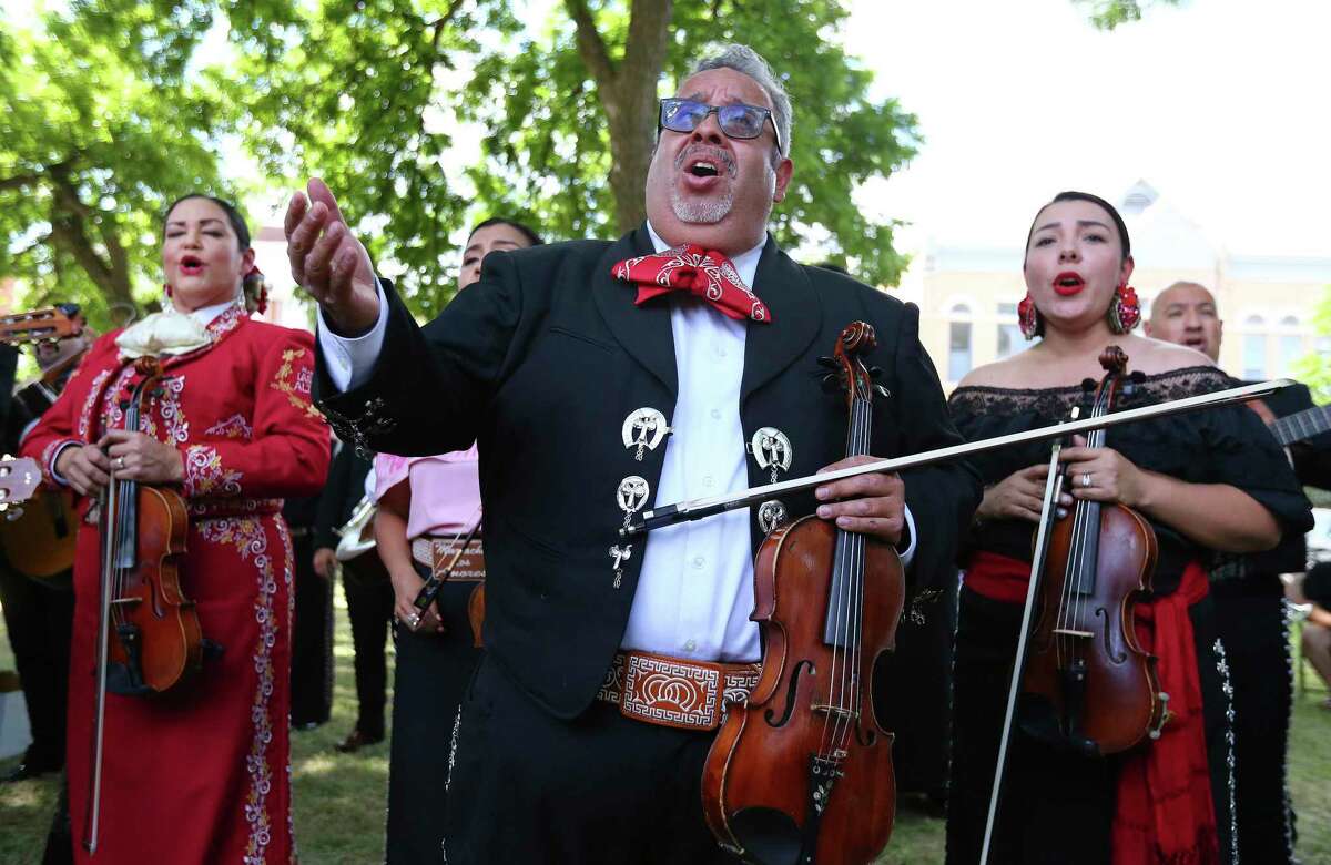Mariachi leader Anthony Medrano (center) sings with a group of 60 mariachis in Uvalde Town Square on Wednesday, June 1, 2022 to honor the town, the Robb Elementary victims and their families.