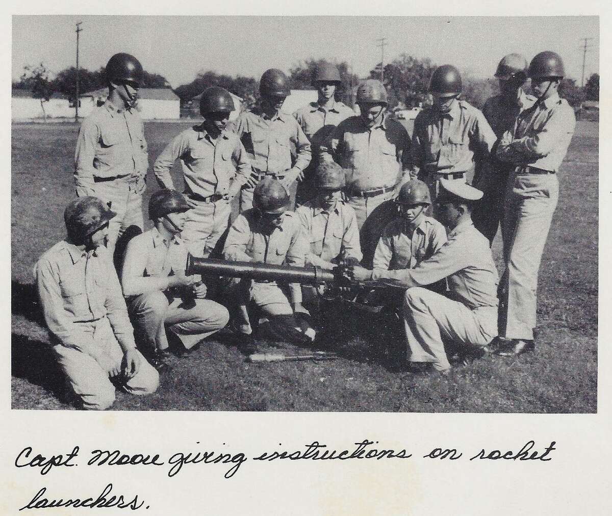 In this photograph from the 1954 Peacock Military Academy yearbook “The Kadet,” instructor John Moore Sr. demonstrates a rocket launcher. The annual was dedicated to Moore and Wesley Peacock Jr., longtime superintendent of the school founded by his father.