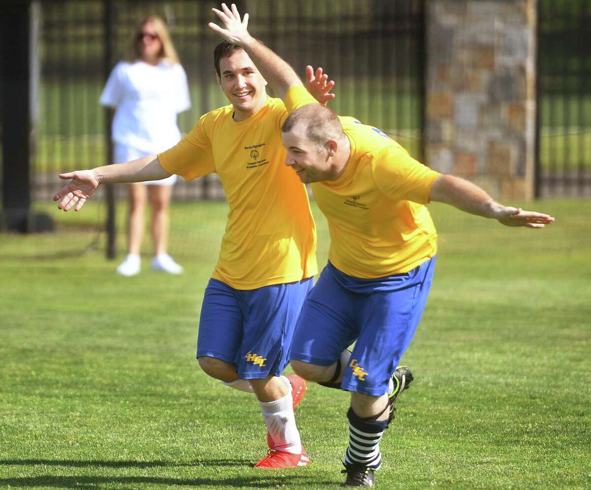Teammates Kyle Marakovits, left, and Matt Baker, of team Chapel Haven Schleifer Center in New Haven, celebrate a goal during Connecticut Special Olympics soccer competition at Fairfield University in Fairfield, Conn. on Saturday, June 4, 2022.