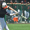 Edwardsville's Cole Funkhouser hits a single up the middle against Minooka during the Class 4A Illinois Wesleyan Sectional championship game on Saturday in Bloomington.