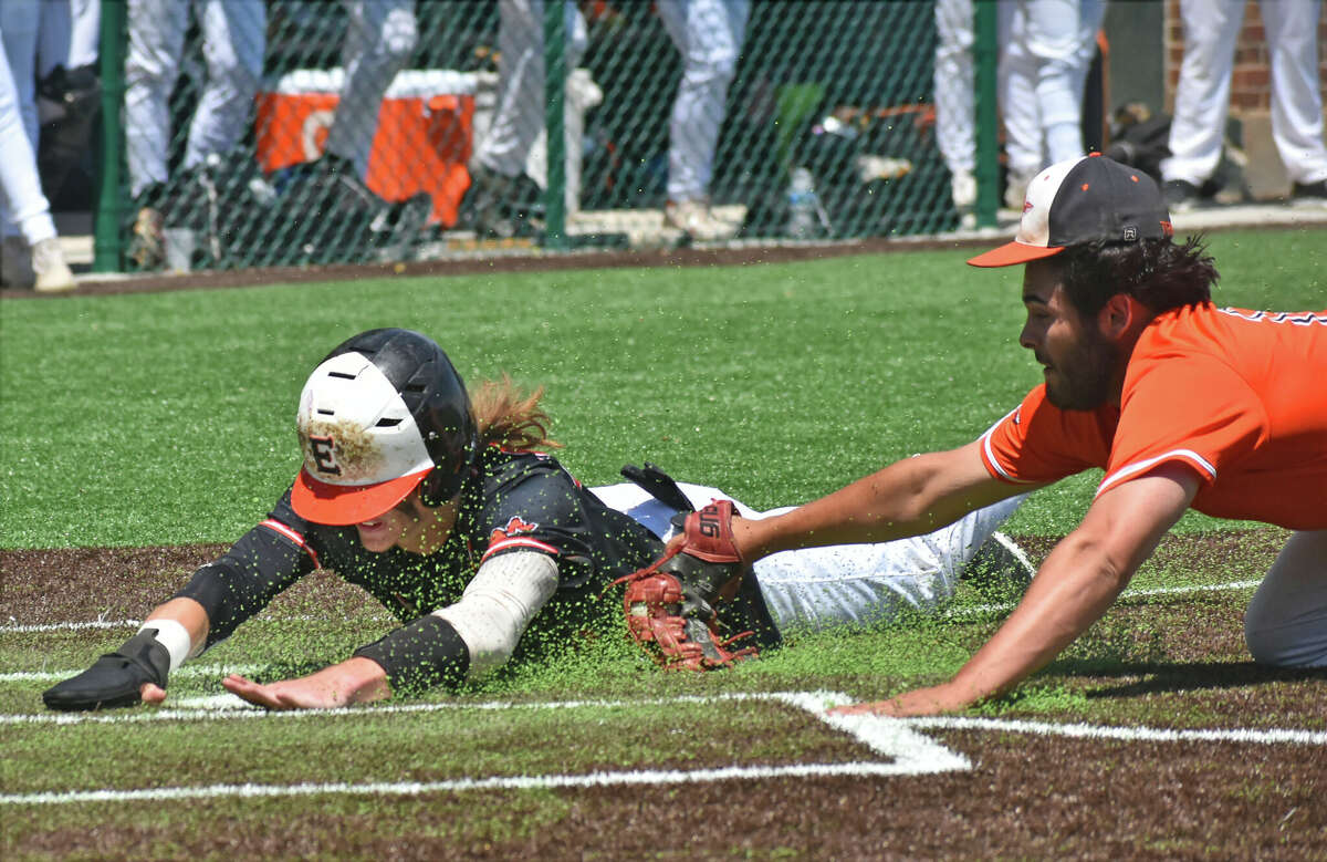 Edwardsville's Grant Huebner scores ahead of the tag against Minooka during the Class 4A Illinois Wesleyan Sectional championship game on Saturday in Bloomington.