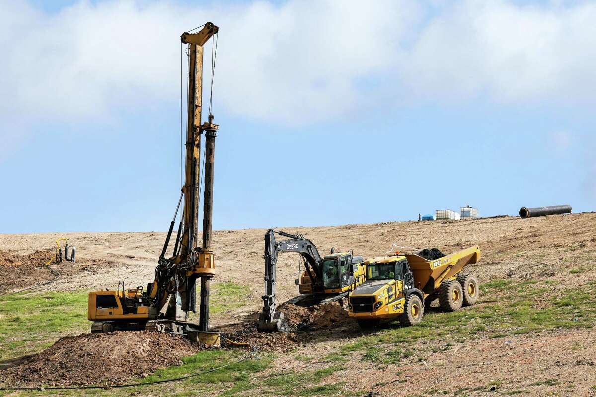 Workers drill a new gas well at the McCarty Road Landfill, run by Republic Services Tuesday, May 31, 2022 in Houston. Archaea Energy is teaming up with the waste management company Republic to develop renewable natural gas projects, which reclaim methane produced in landfills to power generator and other applications of natural gas.