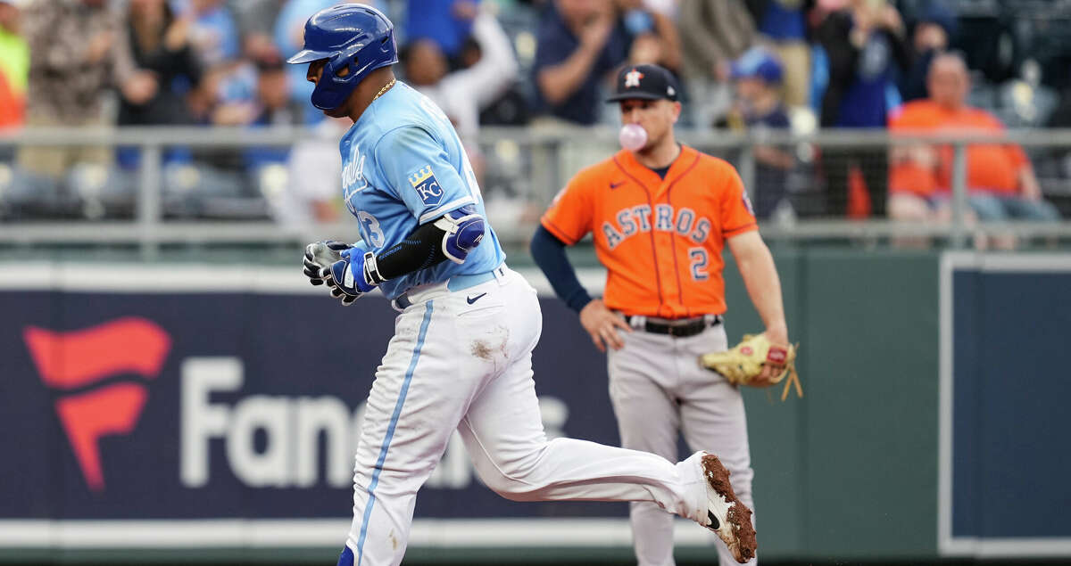 KANSAS CITY, MO - JUNE 04: Salvador Perez #13 of the Kansas City Royals rounds the bases after hitting a home run as Alex Bregman #2 of the Houston Astros looks on during the sixth inning at Kauffman Stadium on June 4, 2022 in Kansas City, Missouri. (Photo by Jay Biggerstaff/Getty Images)