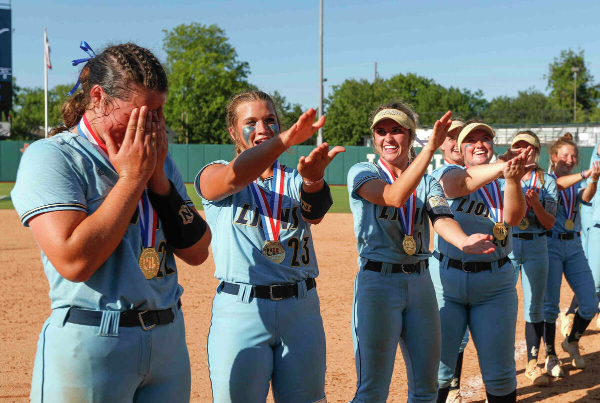 Lake Creek players do the Florida gator chomp as starting pitcher Ava Brown is named the MVP after shutting out Georgetown 7-0 to win the Class 5A championship during the UIL State Softball Championships at Red & Charline McCombs Field, Saturday, June 4, 2022, Austin.