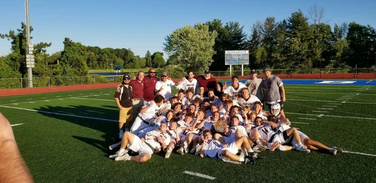 Burnt Hills-Ballston Lake players pose for a picture after winning the state quarterfinal against Pelham on Saturday, June 4, 2022, at Shaker High School.