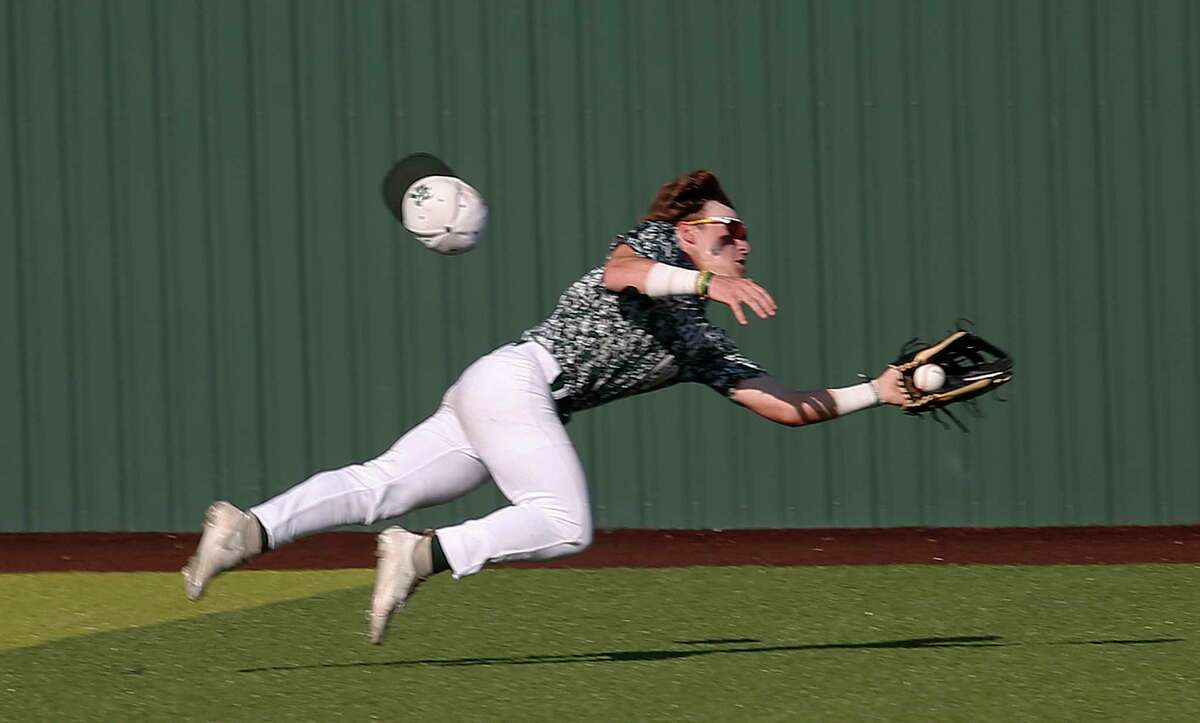 Reagan center fielder Luke Sasser (8) sets the tone with this spectacular catch in the first inning as Reagan defeated Lake Travis 6-2 in Region IV-5A final Game 3 on Saturday, June 4, 2022.