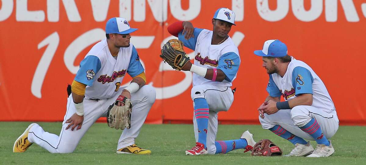 During a pitching change, Flying Chancelas de San Antonio Esteury Ruiz (3),center, talks with teammates Thomas Milone (7),L, and Tirso Ornelas (34)San Antonio Missions (Flying Chanclas) were defeated by Midland Rockhounds 3-0 on Thursday, May 19, 2022 Wolff Stadium.