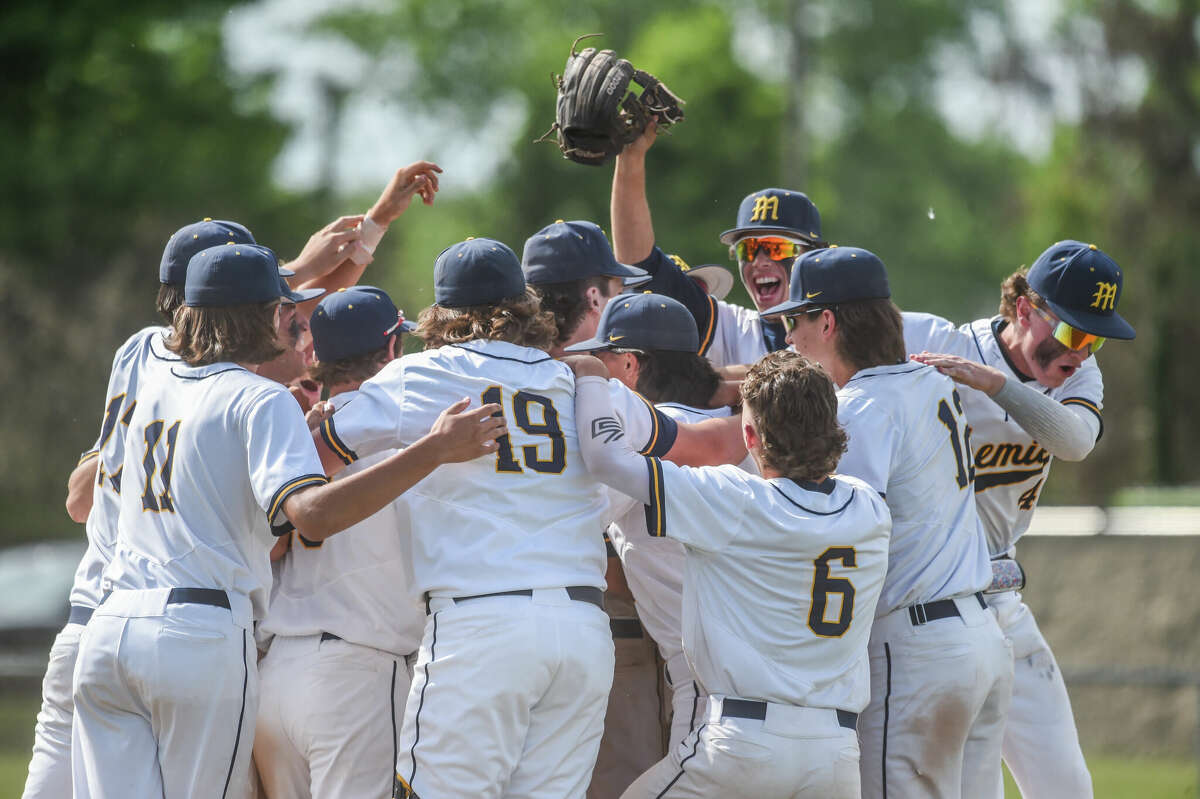 Midland celebrates a district championship after the District finals game between Midland High and Bay City Western on Saturday, June 4, 2022 at Heritage High School.