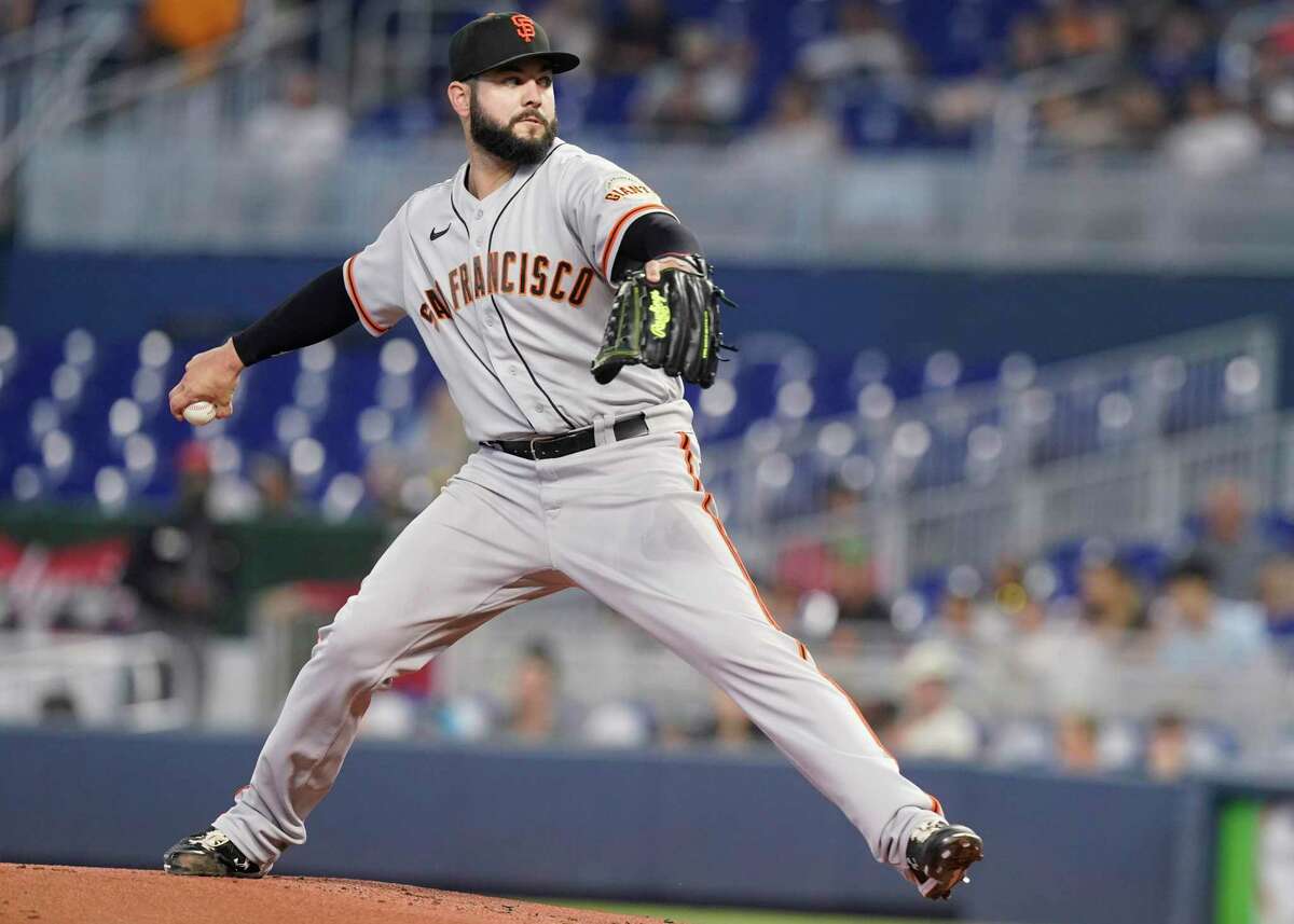 San Francisco Giants starting pitcher Jakob Junis (34) throws a pitch during the first inning of a baseball game against the Miami Marlins, Sunday, June 5, 2022, in Miami. (AP Photo/Marta Lavandier)