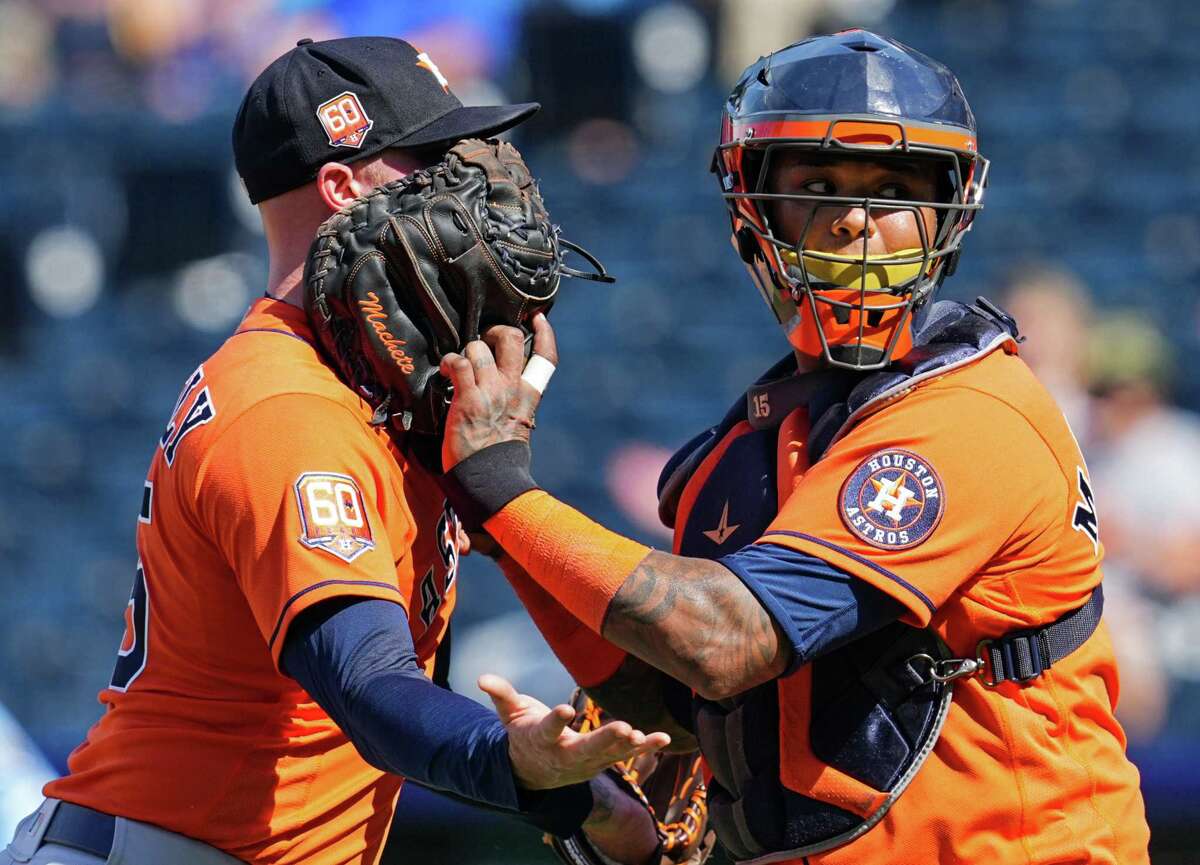 KANSAS CITY, MO - JUNE 05: Ryan Pressly #55 of the Houston Astros is restrained by Martin Maldonado #15 after being ejected during the ninth inning against the Kansas City Royals at Kauffman Stadium on June 5, 2022 in Kansas City, Missouri.