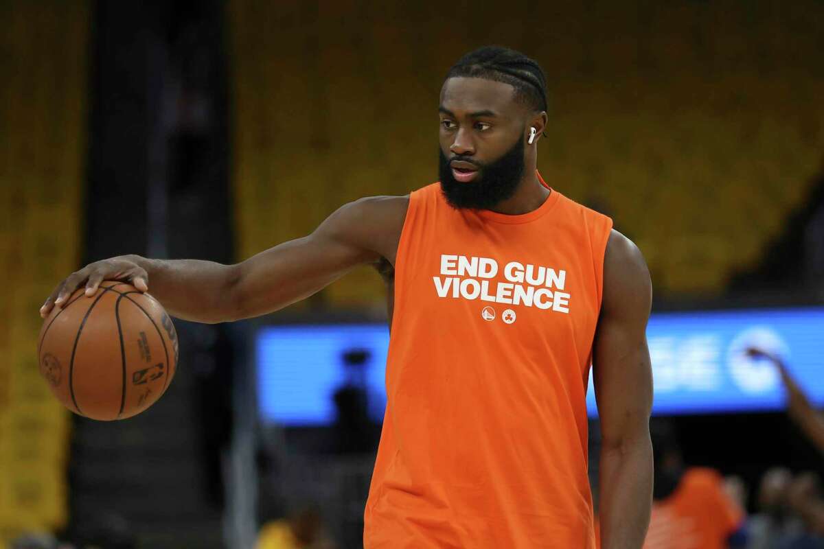 Boston Celtics guard Jaylen Brown wears a shirt reading “End Gun Violence” while warming up before Game 2 of the NBA Finals against the Golden State Warriors in San Francisco on Sunday.