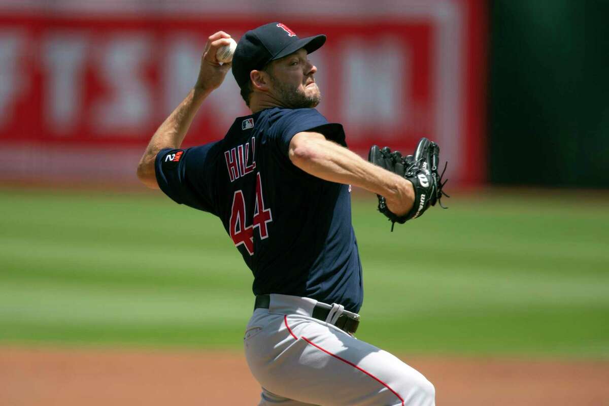 Boston Red Sox starting pitcher Rich Hill delivers against the Oakland Athletics during the first inning of a baseball game, Sunday, June 5, 2022, in Oakland, Calif. (AP Photo/D. Ross Cameron)