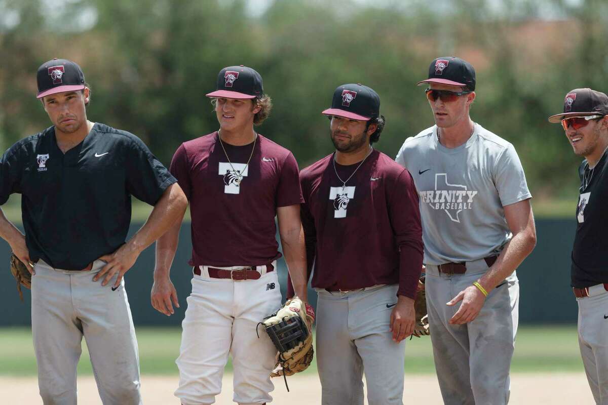 Trinity Tigers baseball players listen to instructions from head coach Tim Scannell during practice Tuesday, May 31, 2022. The Tigers will be traveling to Cedar Rapids, Iowa, to play in the Division III College World Series on Friday.