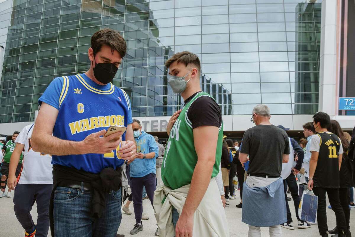 NBA fans wait outside the Chase Center before the Golden State Warriors play the Boston Celtics for Game 2 of NBA Finals at Chase Center in San Francisco, Calif., on Sunday, June 5, 2022.