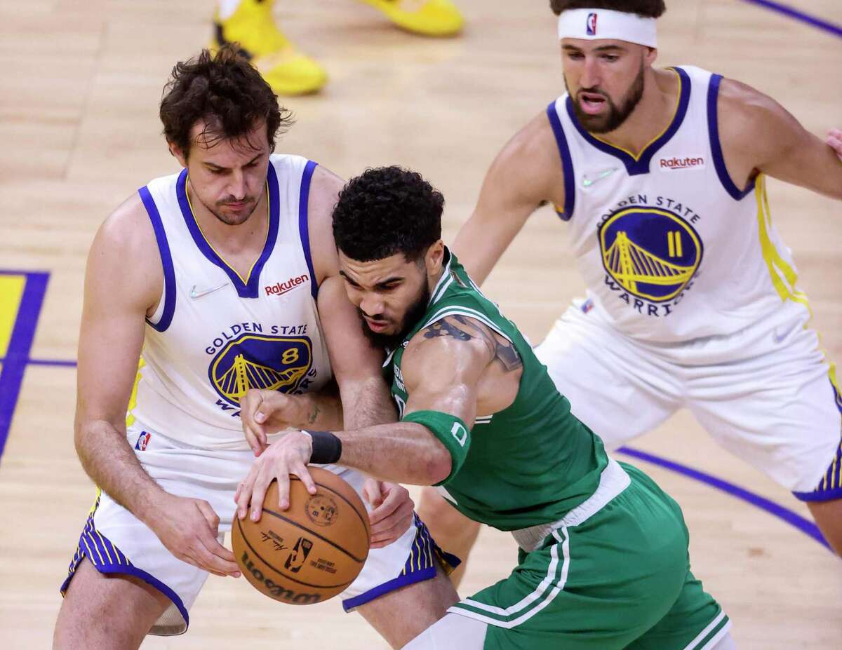 Boston Celtics' Jayson Tatum, 0, tries to get past Golden State Warriors' Nemanja Bjelica, 8,during the second quarter of the NBA Finals at Chase Center in San Francisco, Calif., on Sunday, June 5, 2022.
