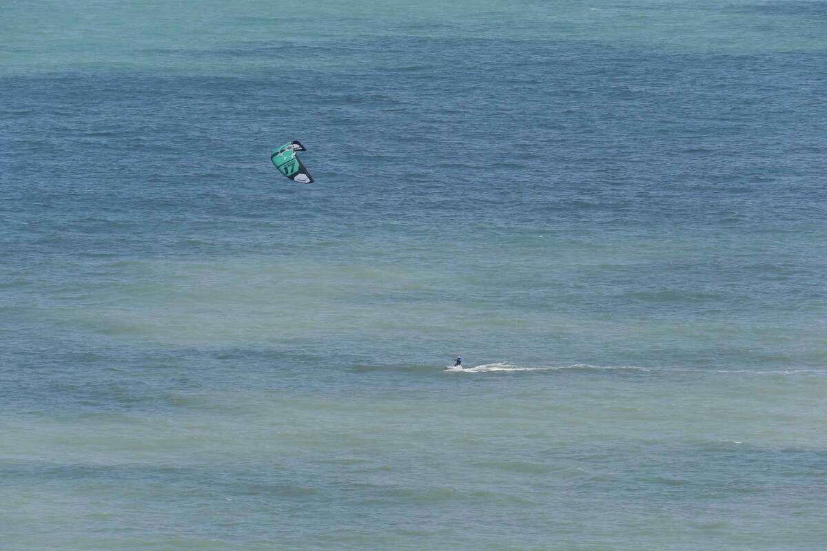 Galveston's brown beach water turned blue again. Here's why.