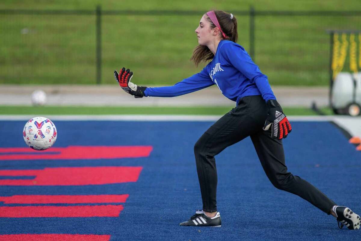 West Brook goalie Lili Ross rolls a ball out to her teammates. 
