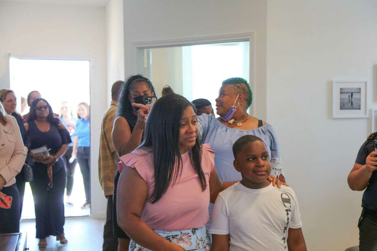Army Specialist Kisha Dorsey and her family got to explore their new mortgage-free home in Hockley for the first time during a dedication event held May 26, 2022.