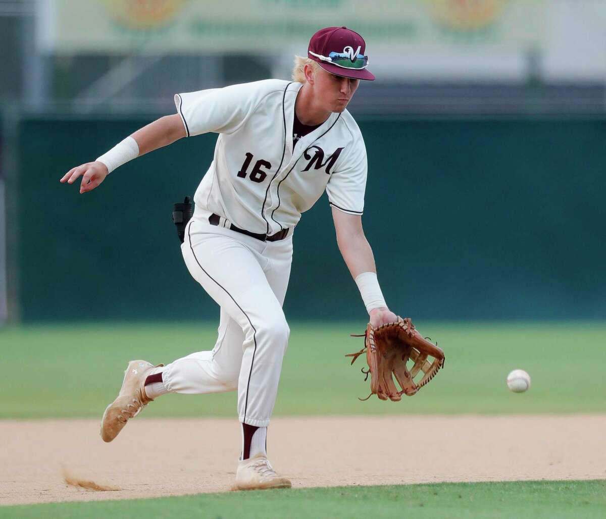Magnolia third baseman TJ Peters (16) fields a ground ball by Samson Pugh #10 of Lake Creek in the first inning of Game 2 of a Region III-5A quarterfinal high school baseball playoff series at Magnolia High School, Friday, 20, 2022, in Magnolia.